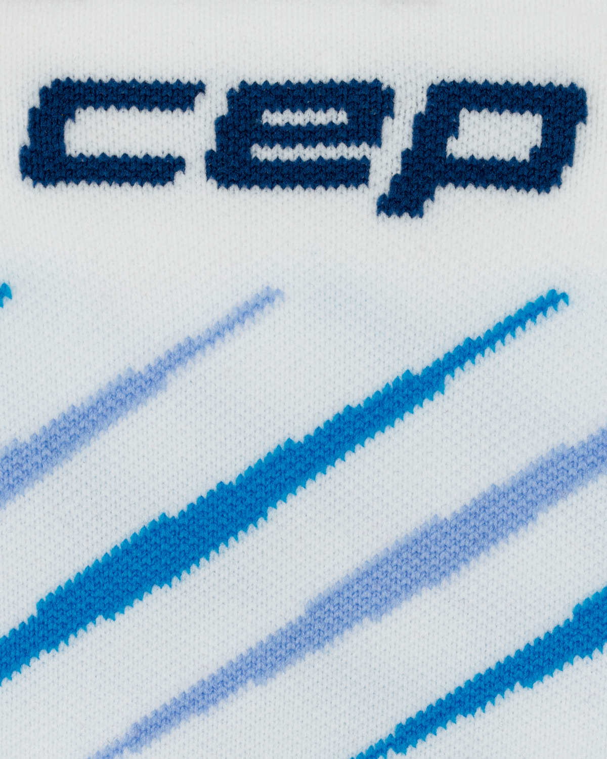 Core Run Claw Mid Cut Compression Socks, White/Blue, close-up detail